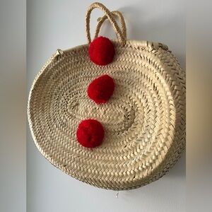 Round Straw Tote with Red Pom-Poms from Morocco